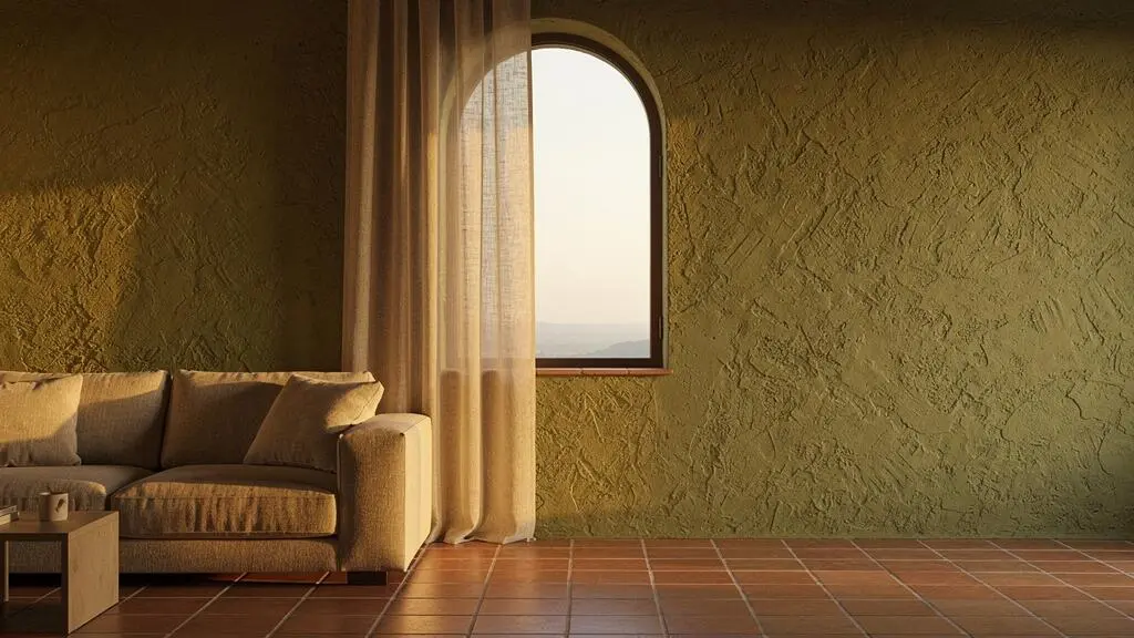 Salón español bañado por luz natural difusa que entra por un gran ventanal con cortina de lino, sin deslumbramiento